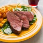 Sous Vide Flat Iron Steak on a bed of kale salad