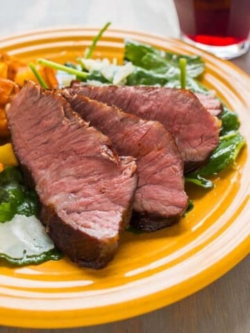 Sous Vide Flat Iron Steak on a bed of kale salad