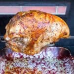 Rotisserie Turkey Breast browning on a grill