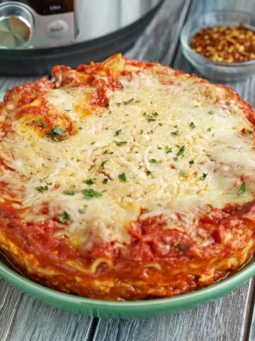 Instant Pot Lasagna on a plate with spices in the background