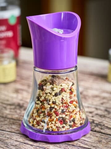All-Purpose Seasoning blend in a grinder jar