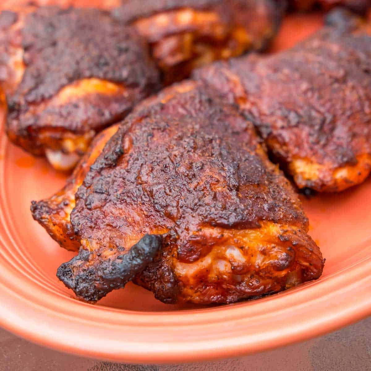 Grilled BBQ Chicken thighs on a platter