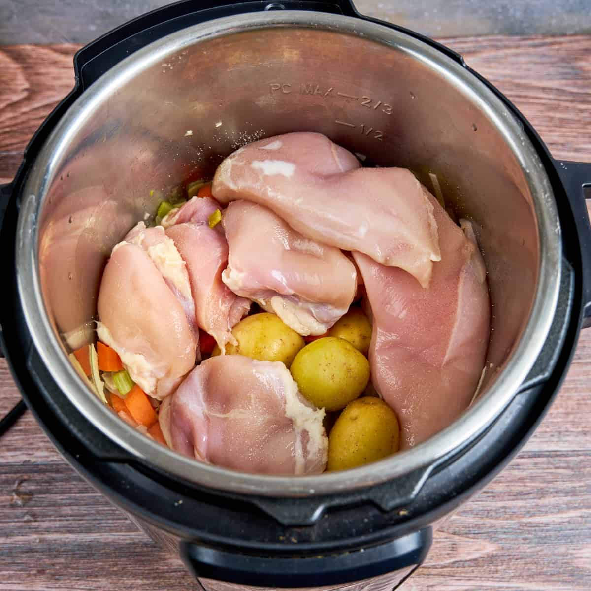 Add the chicken and potatoes to the pot, then pour in the broth