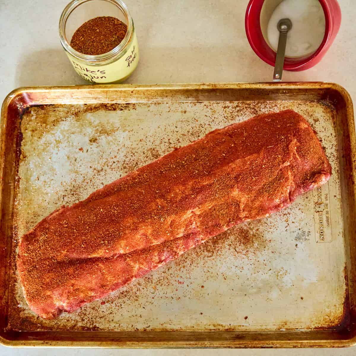 Slab of ribs sprinkled with cajun rub