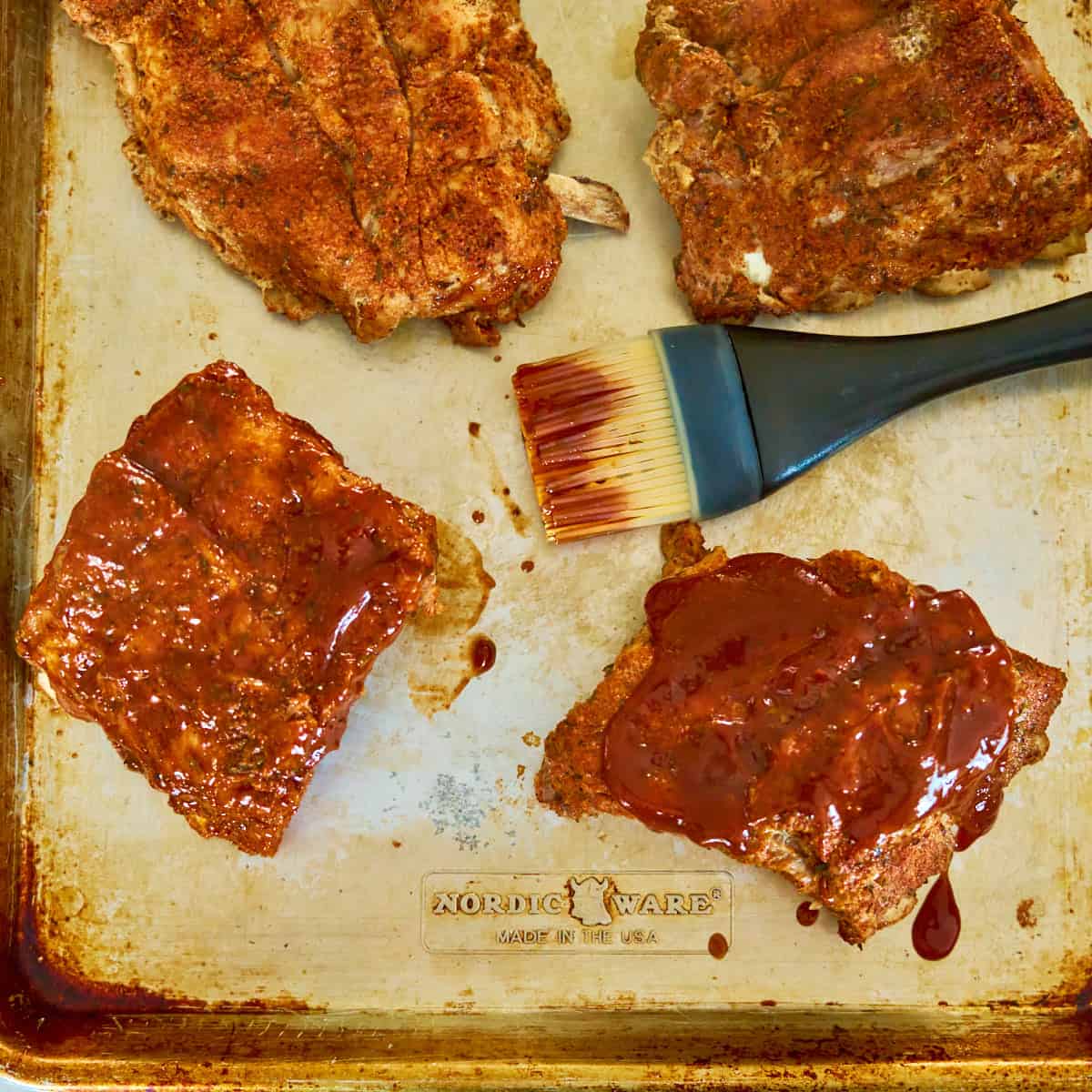 Brushing the ribs with sauce