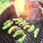 Shishito peppers blistering on the grill (with ribeye flareup in background)
