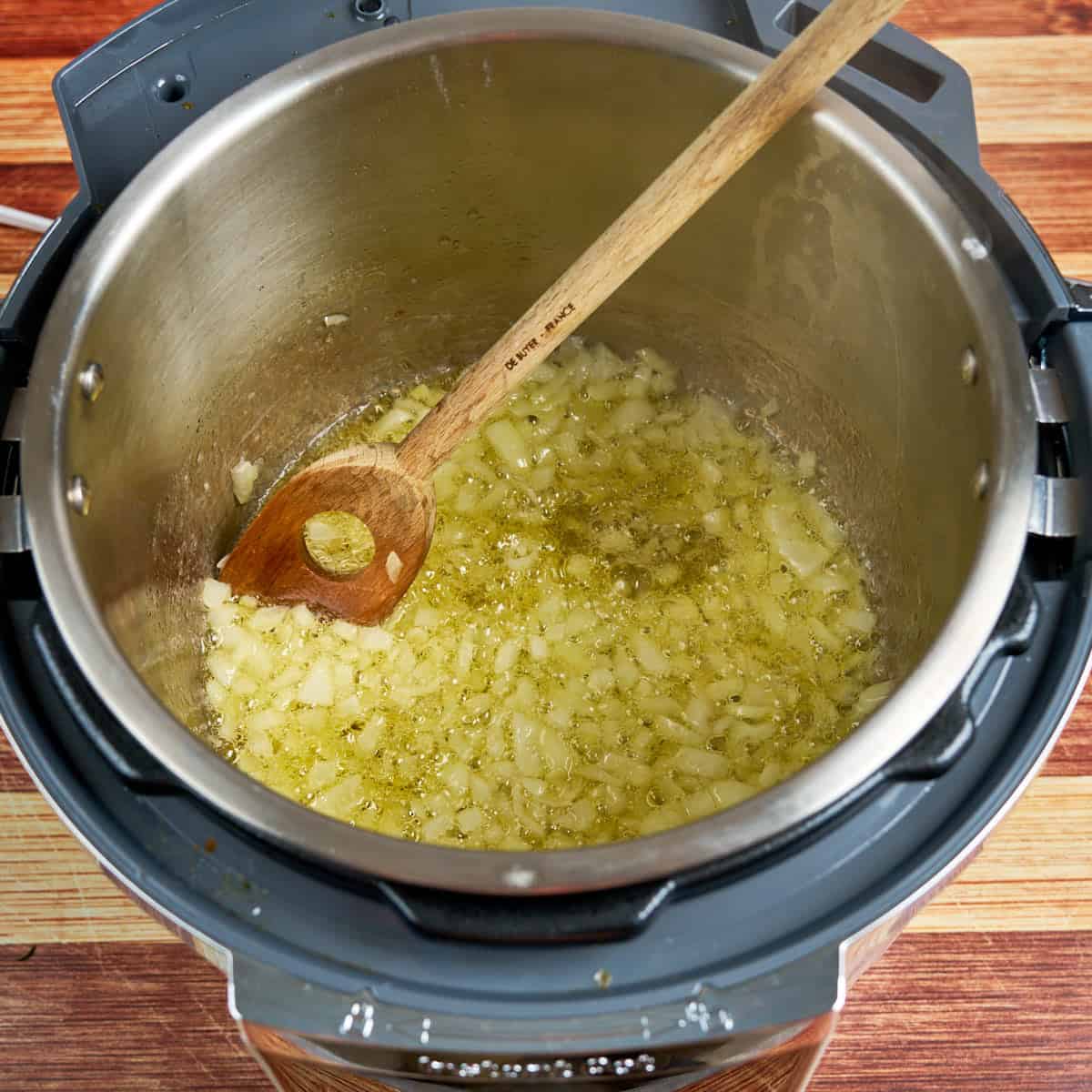 Sautéing the onions in melted butter