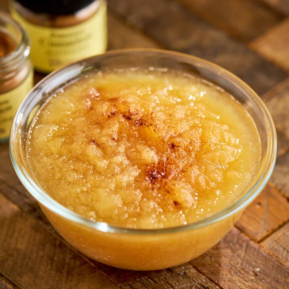 A bowl of Instant Pot Applesauce with some cinnamon sprinkled on it