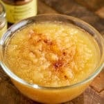 A bowl of Instant Pot Applesauce with some cinnamon sprinkled on it
