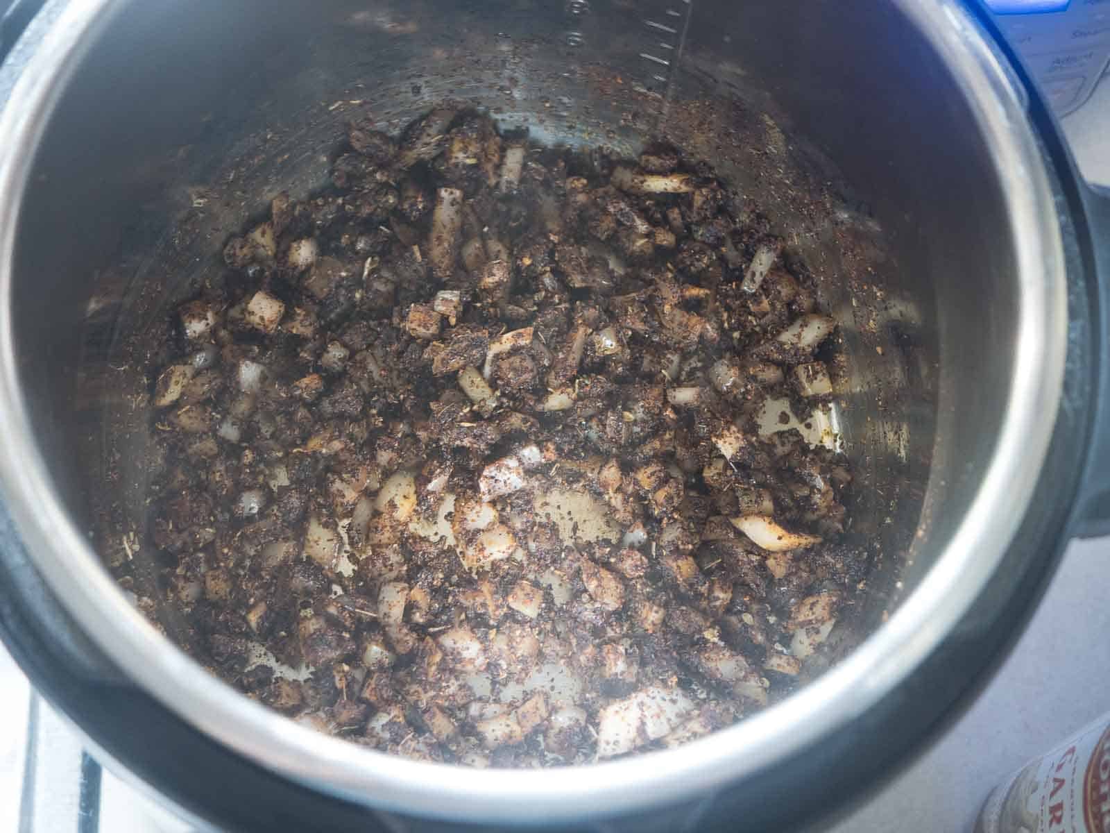 Sautรฉ the onion and toast the spices