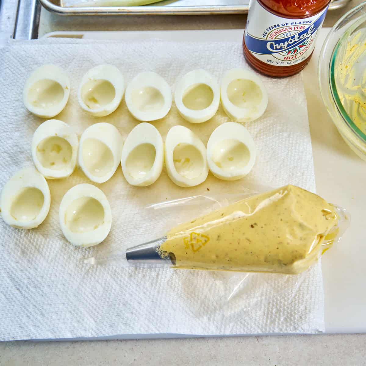 Empty hard boiled egg halves ready to fill with Cajun deviled egg filling