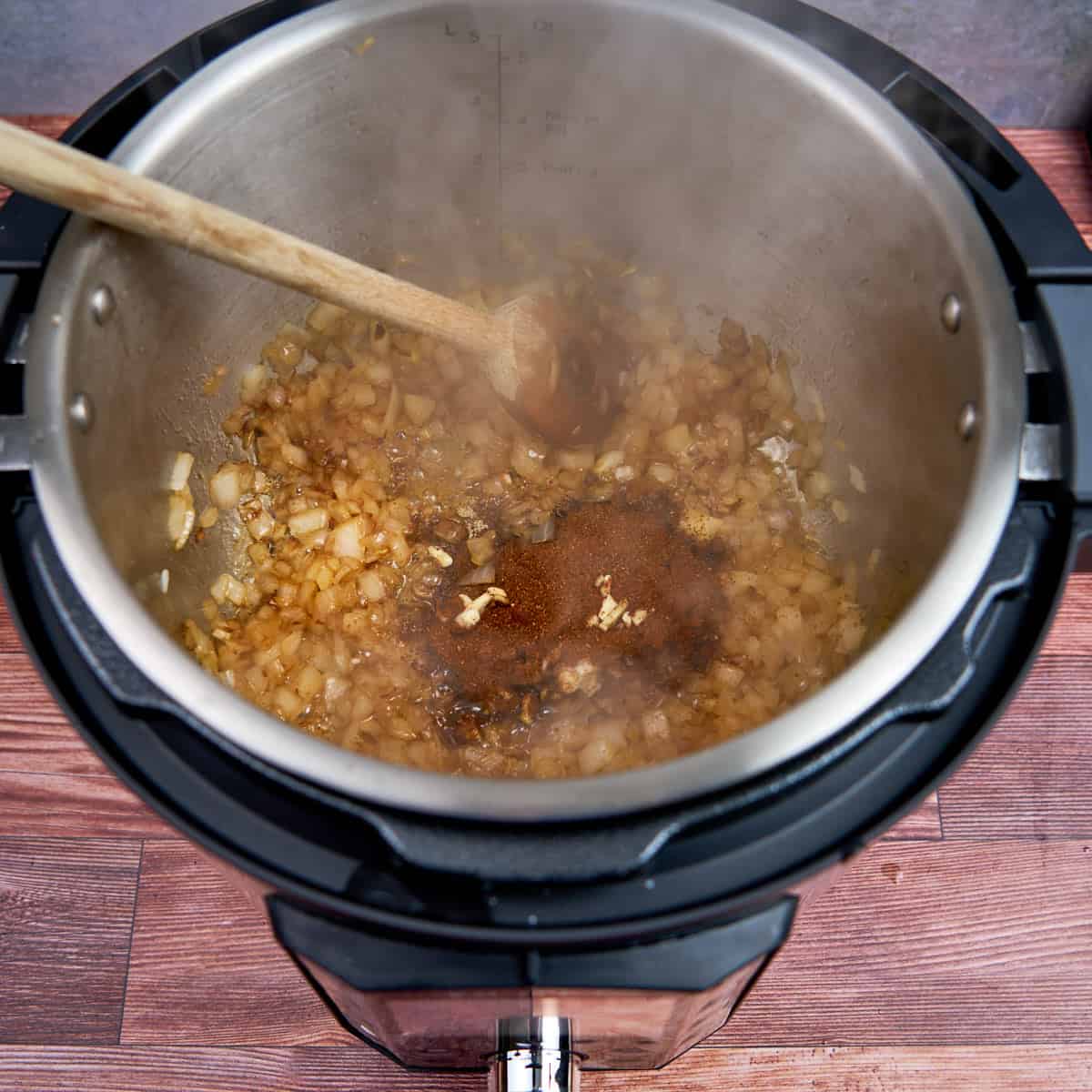 Spices and onions sautéing in the pot