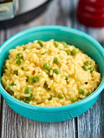 A bowl of Instant Pot Cheddar Risotto (with peas)