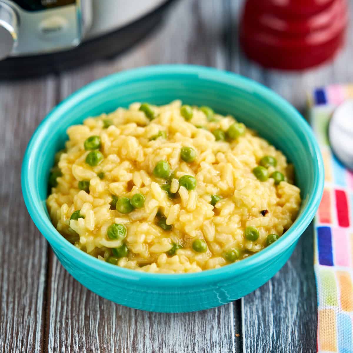 A bowl of Instant Pot Cheddar Risotto (with peas)