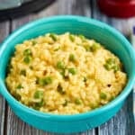 A bowl of Instant Pot Cheddar Risotto with Peas