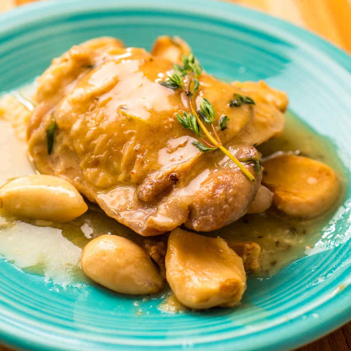 A plate of Instant Pot Chicken with 40 Cloves of Garlic