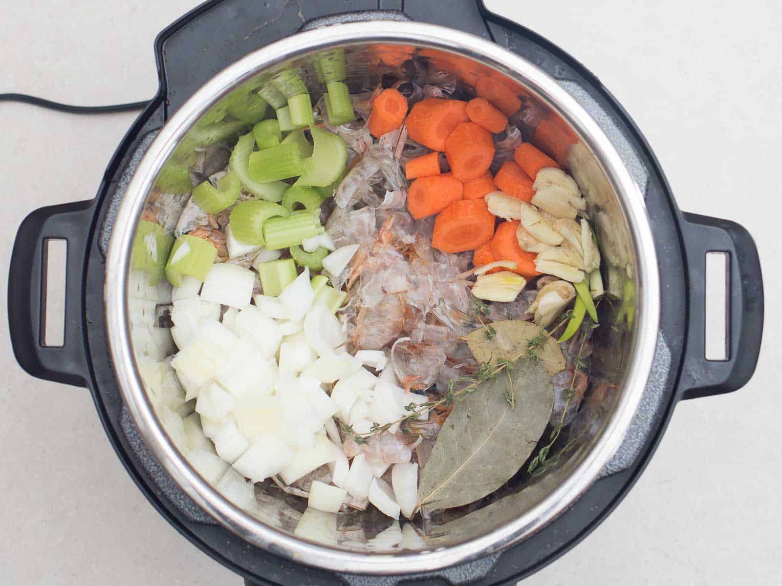 Shrimp stock ingredients ready to pressure cook