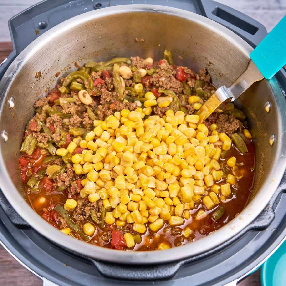 Frozen corn added to the pot of chili