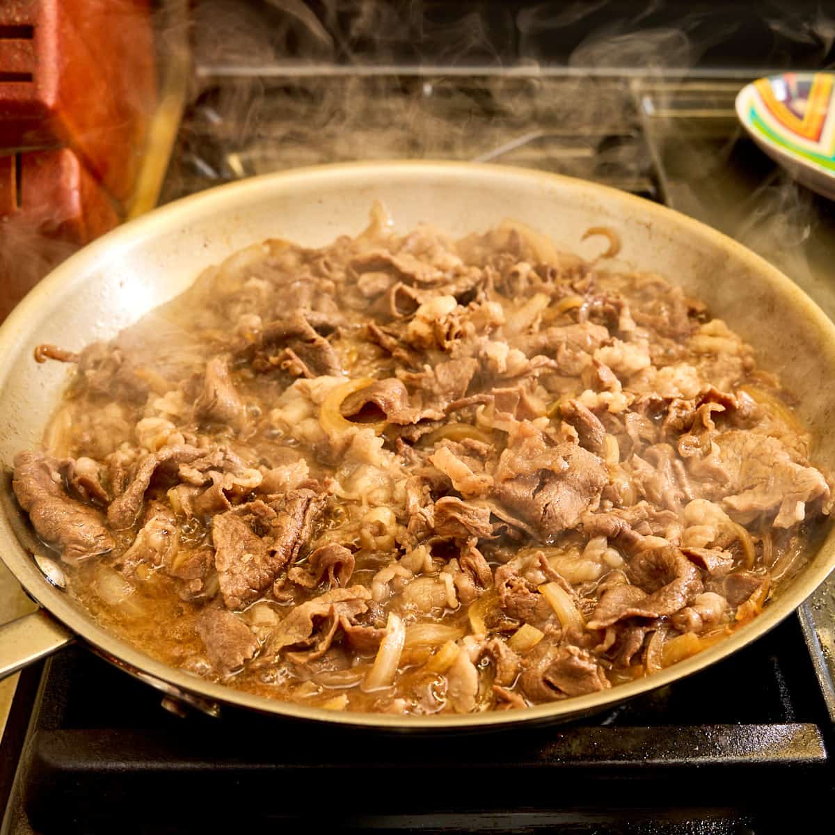 Beef simmering in the broth