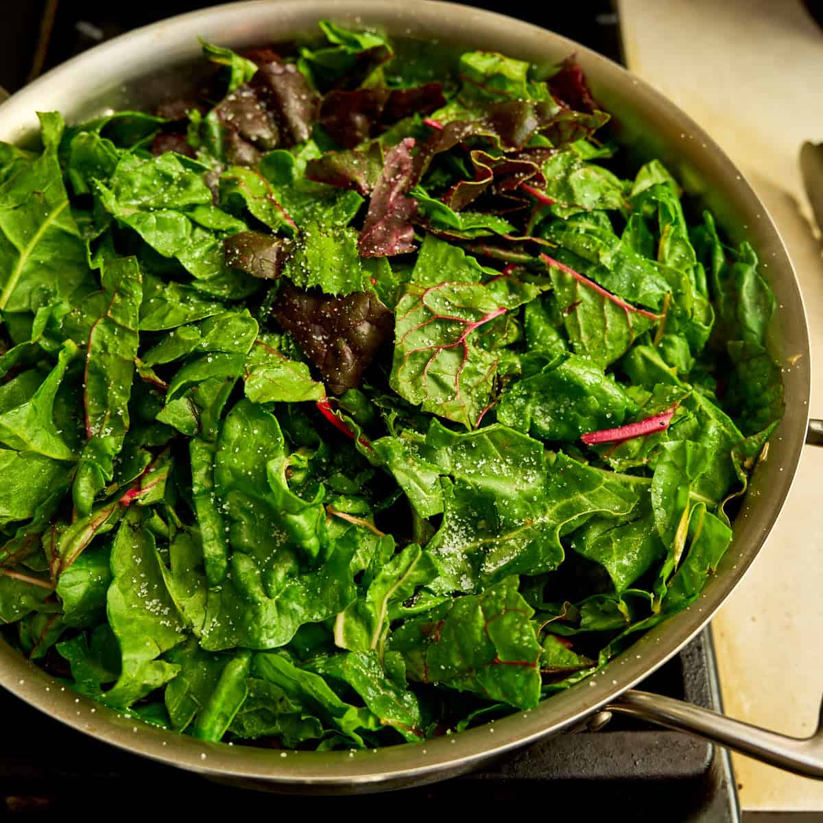 Chard leaves into the pan