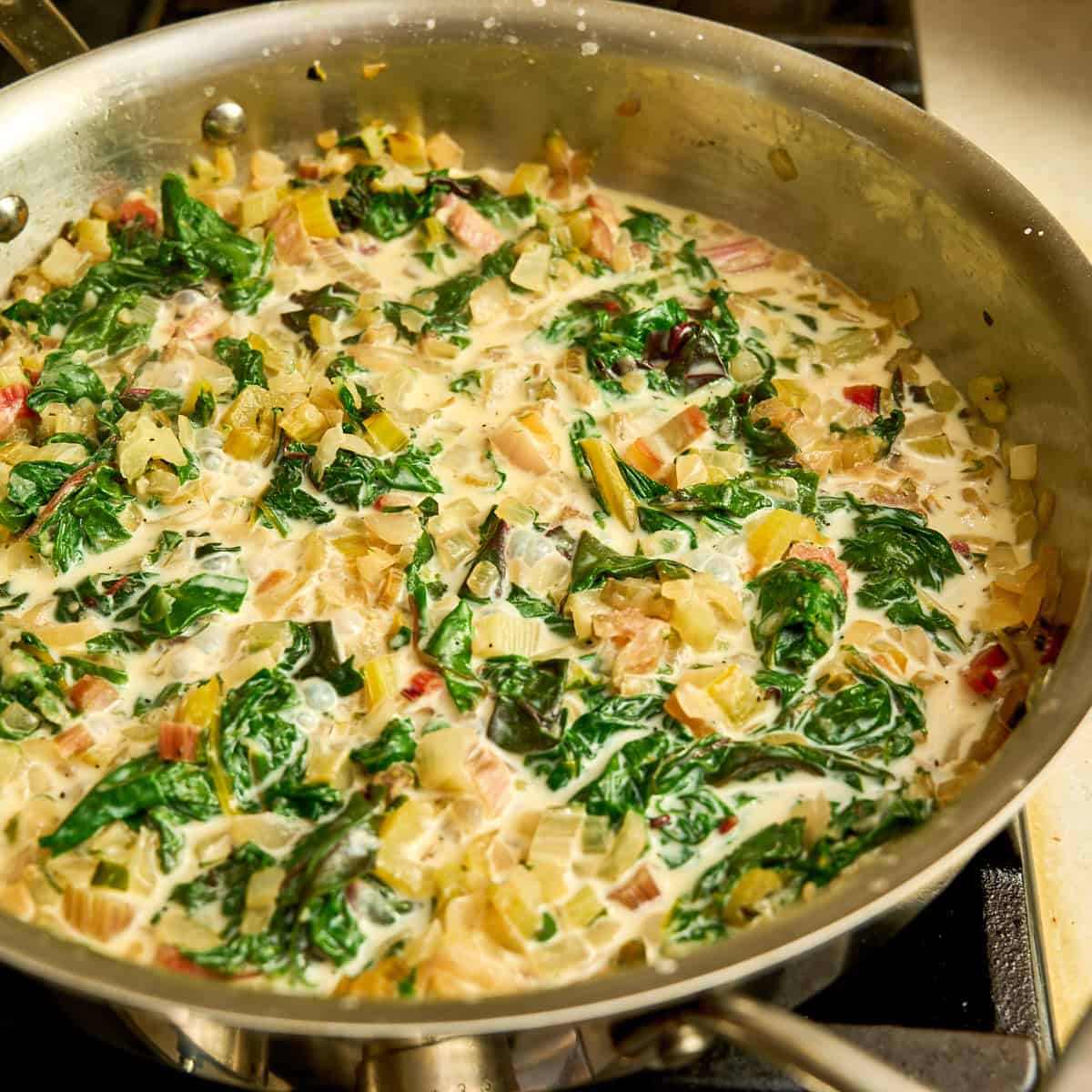 Simmering the milk in the pan