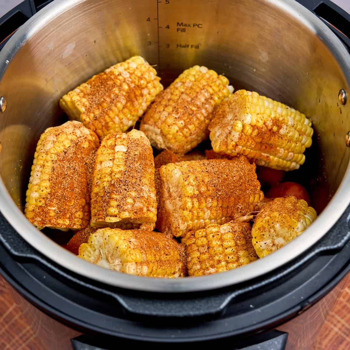 Layer of corn sprinkled with seasoning