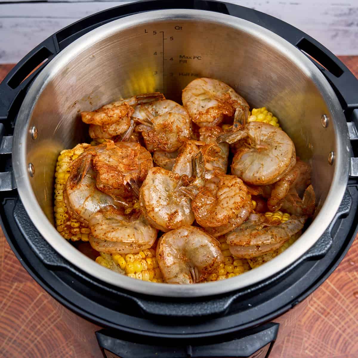 Layer of shrimp on top of the pot