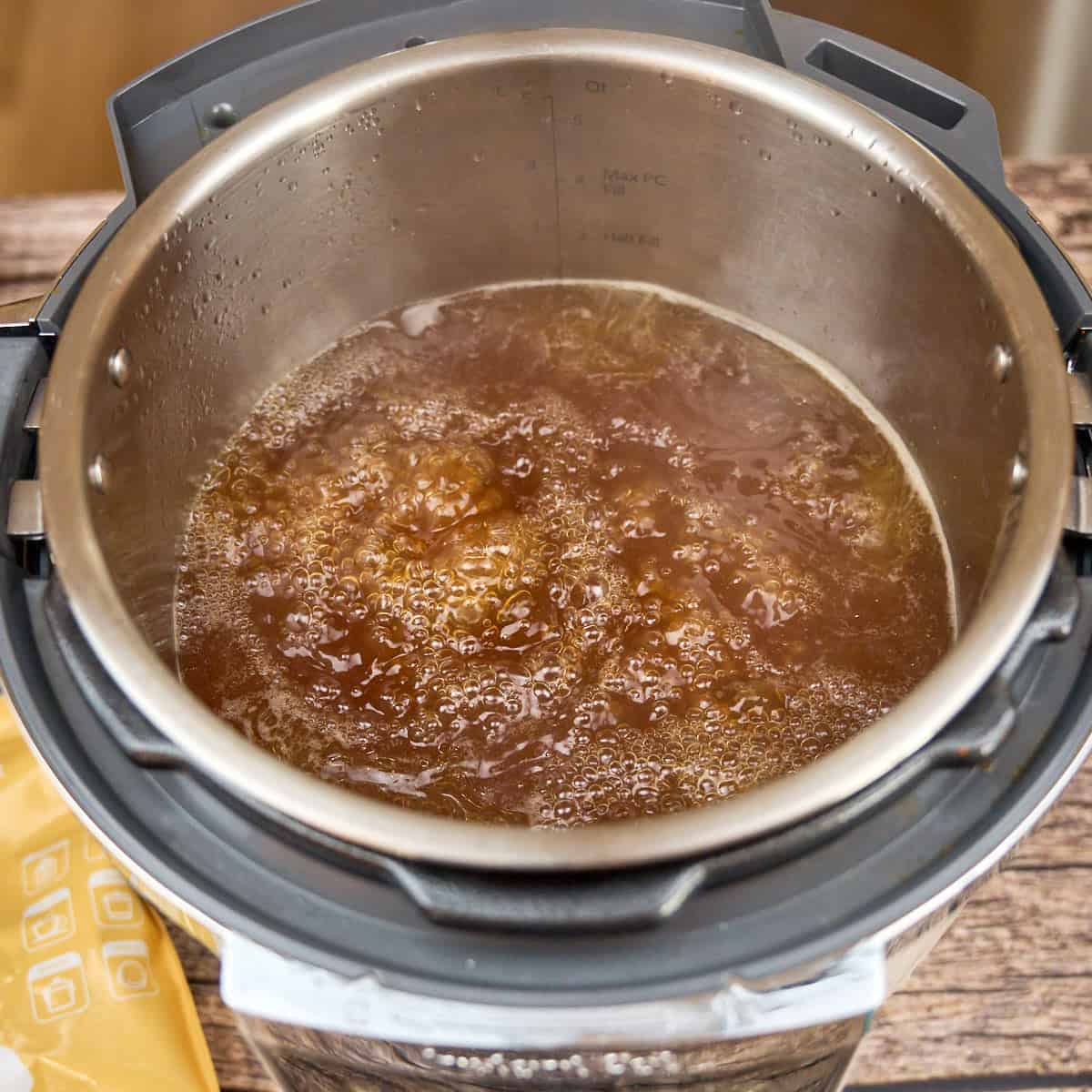 Simmering fish sauce and rock sugar in pho broth
