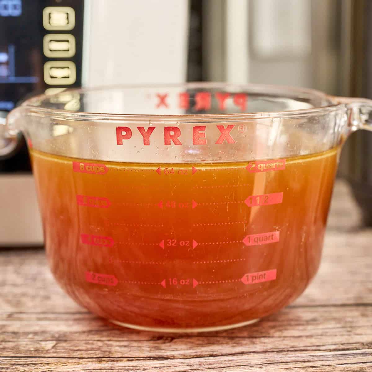 Strained Pho Broth in a 2 quart pyrex