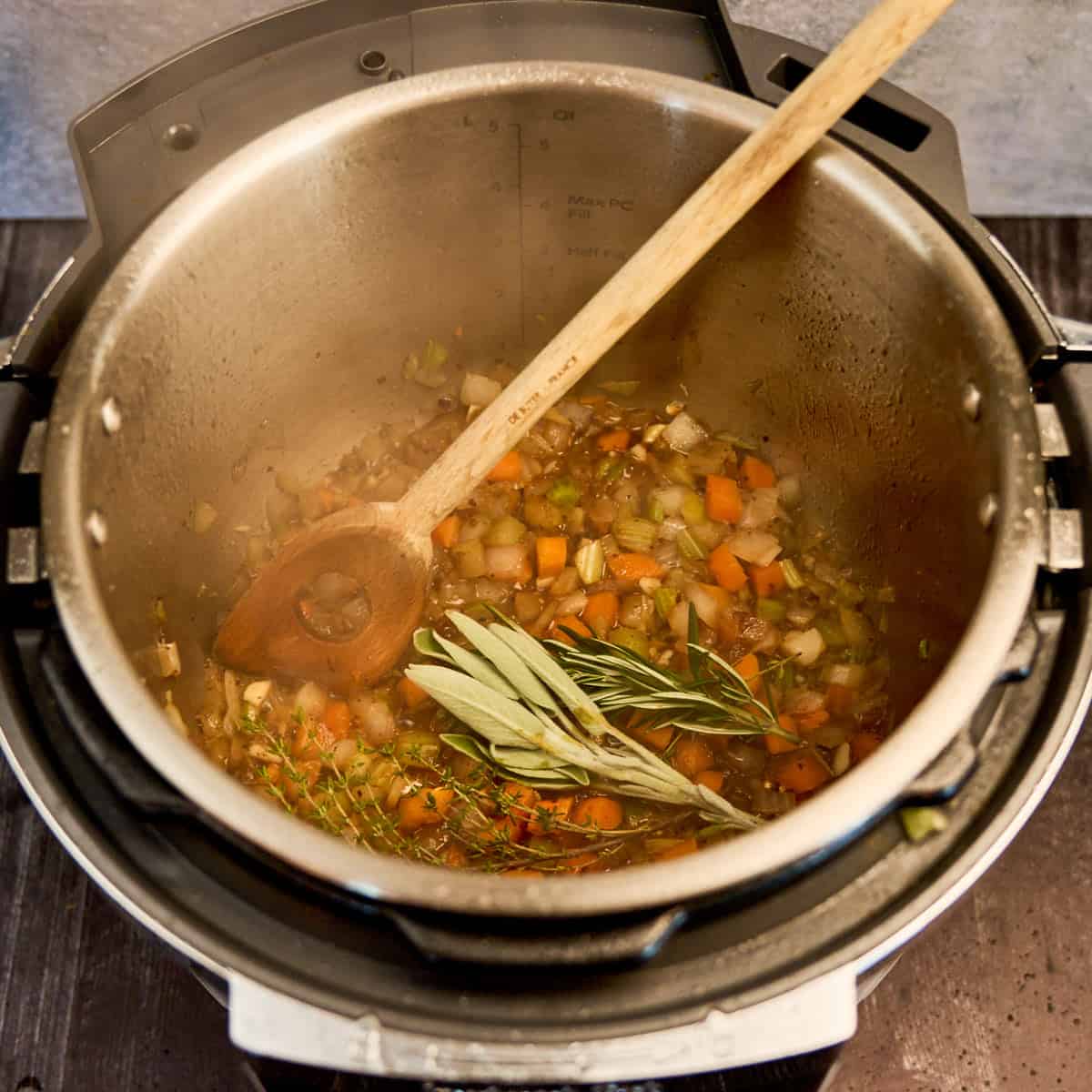 Simmering the wine and herbs